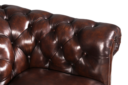Hauptstadt Möblerei Chesterfield Ledersessel in Dunkelbraun mit klassischer Knopfheftung und geschwungener Armlehne